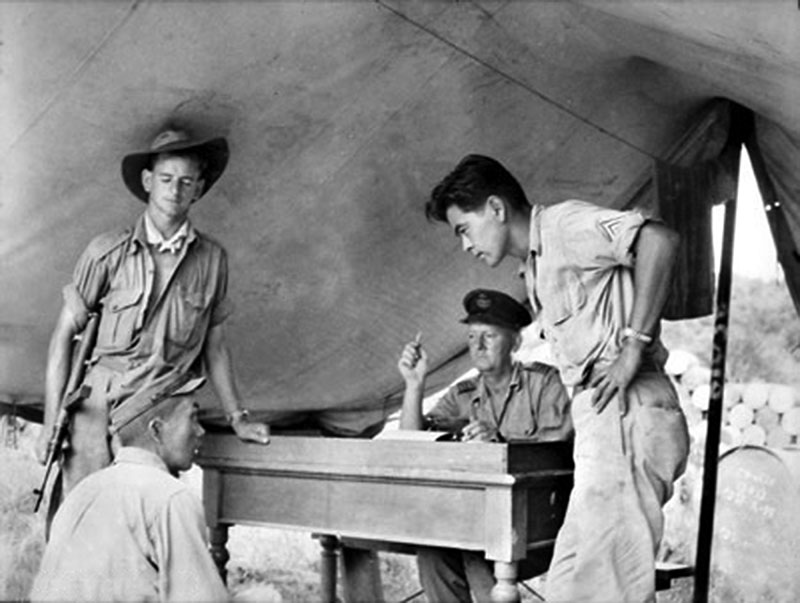 MIS soldier assigned to Australian forces interrogates Japanese prisoner.