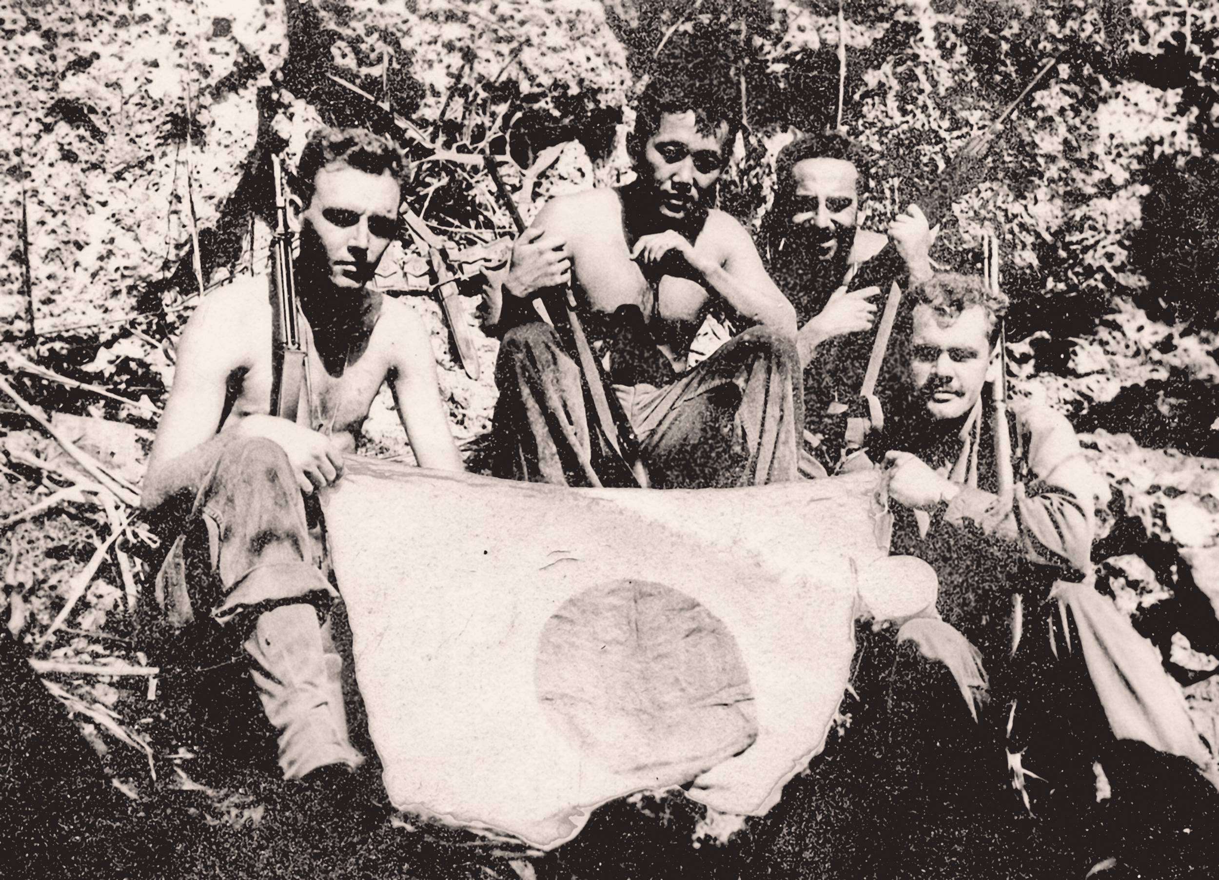 Hoichi Bob Kubo and fellow soldiers with captured Japanese flag